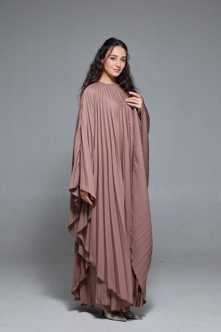 Delia Abaya in Brown