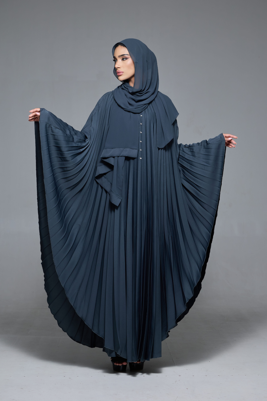 Delia Abaya in Dark Grey