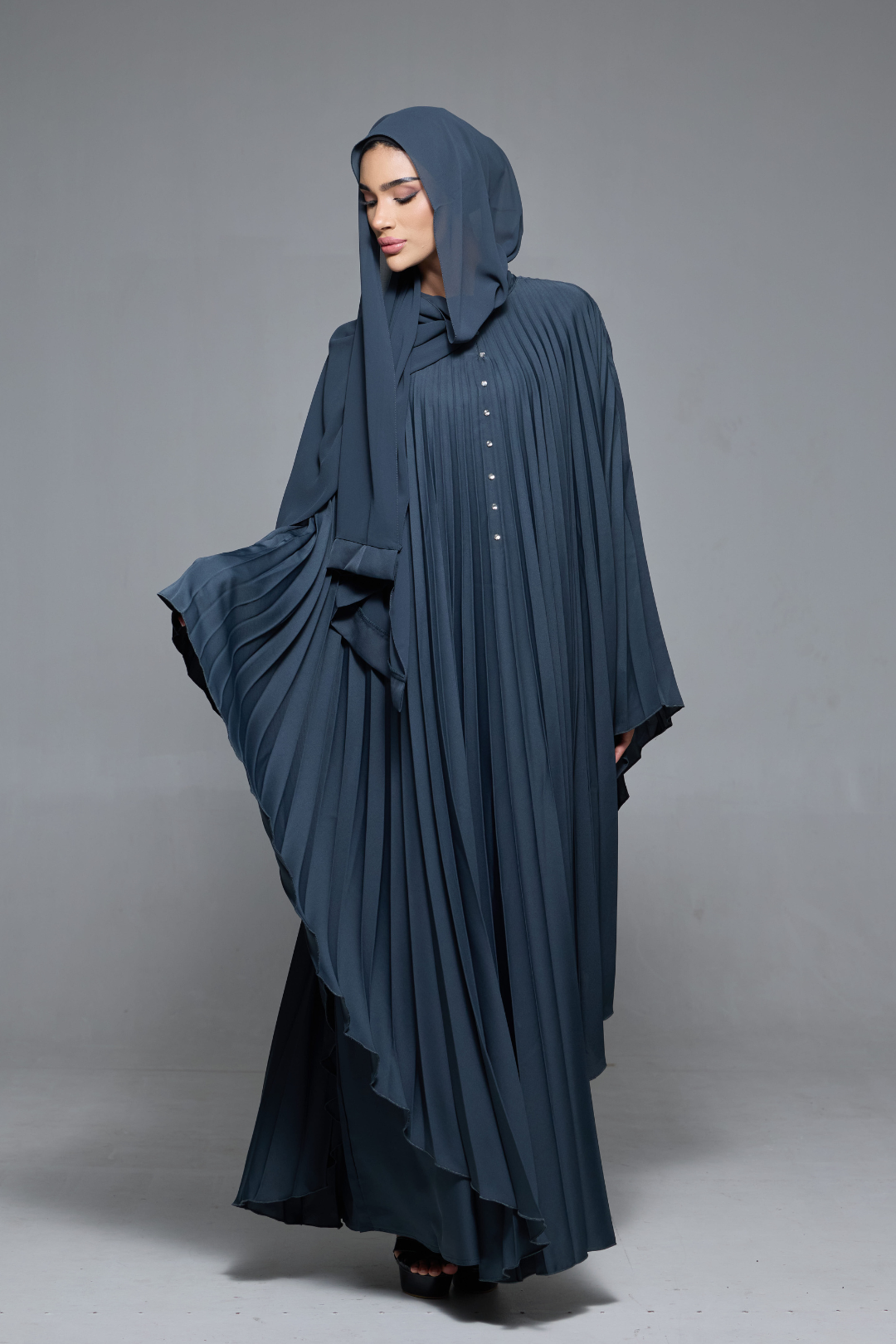 Delia Abaya in Dark Grey