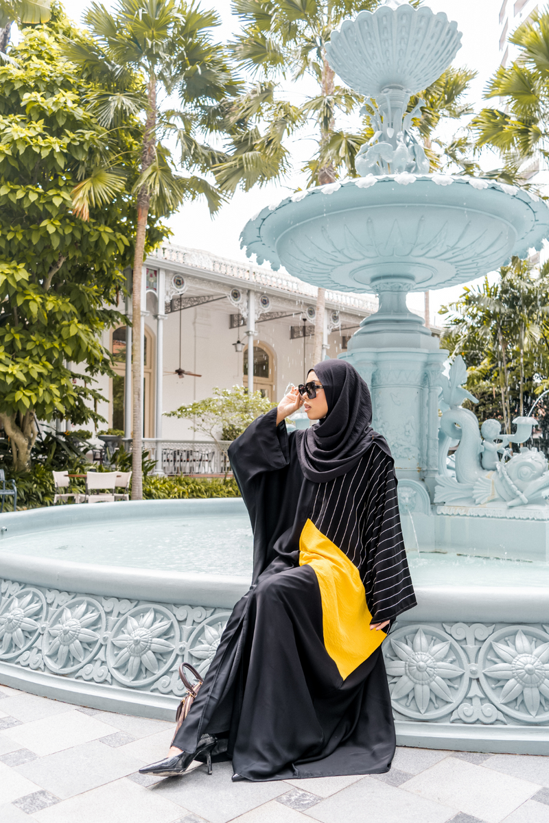 Singapore Muslimah model in hijab wearing modest mixed polyester crinkle nidha in black and yellow