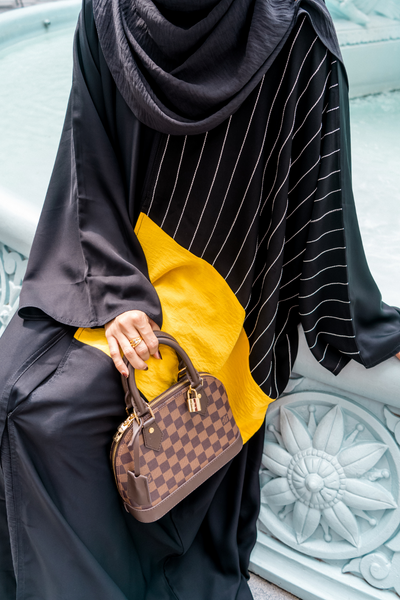 Singapore Muslimah model in hijab wearing modest mixed polyester crinkle nidha in black and yellow