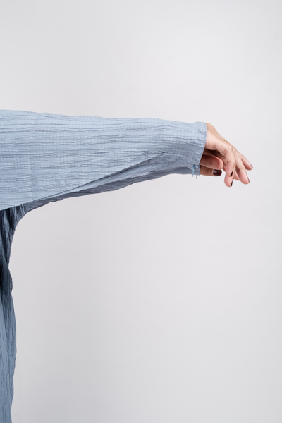Close up of kaftan with wudhu-friendly zip on sleeves