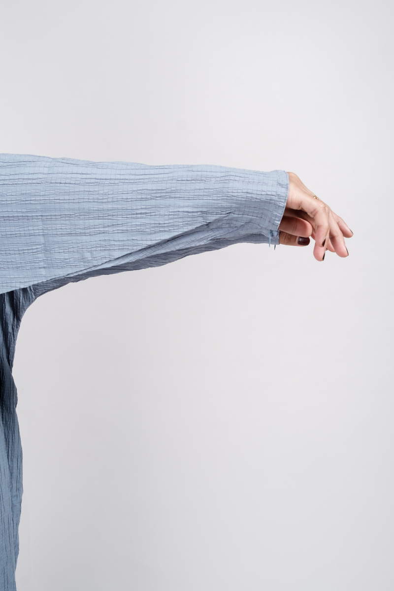 Close up of kaftan with wudhu-friendly zip on sleeves