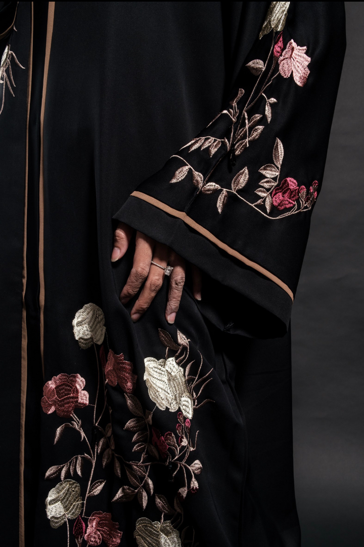 Singapore Muslimah model wearing embroidered black closed abaya in nidha with floral details