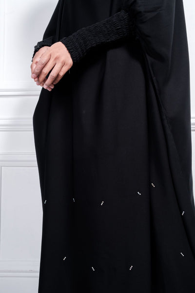 The Jilbab Abaya is made with Nidha Fabric, cooling and soft. Perfect for umrah or to be used as a prayer wear. Smock sleeves with hidden zip allows for ease of wudhu. Simple tie-back, adjustable to fit you. 