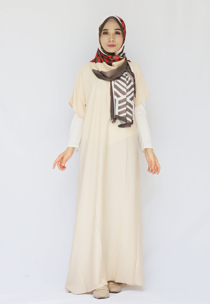 Modest Muslim Hijab Model is in cream short sleeved inner. made with crinkle silk and is wearing shawl from duck